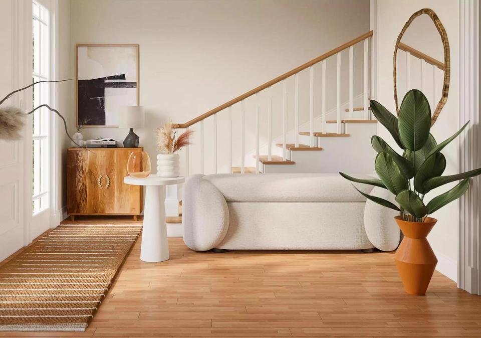 Scandinavian-inspired foyer with natural wood, white railings, and minimal warm lighting