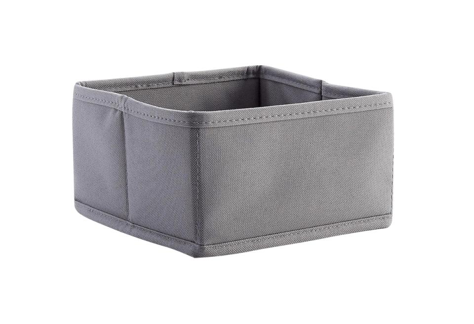 Soft gray fabric storage bin with contemporary aesthetic and structured form