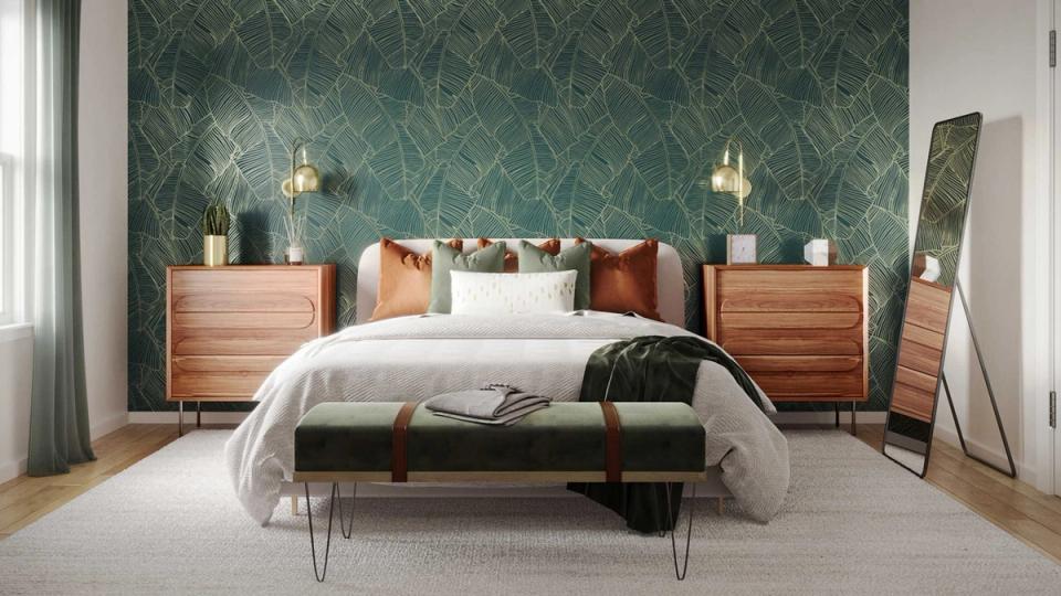 Mid-century bedroom with teal damask wallpaper, warm wood nightstands, and brass pendant lighting