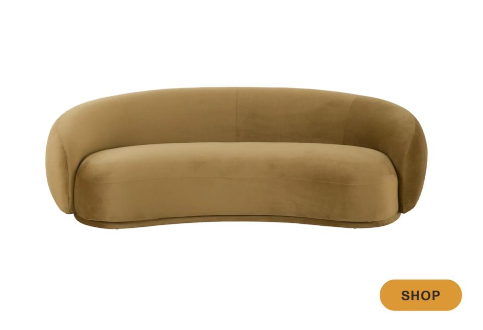 Contemporary curved camel sofa with organic rounded shape and minimalist design