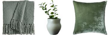 Sage green textured throw, ceramic planter, and velvet pillow in muted green tones