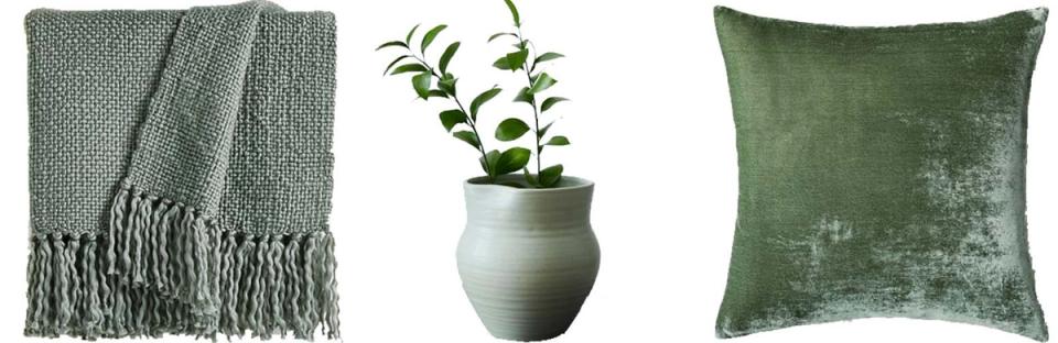 Sage green textured throw, ceramic planter, and velvet pillow in muted green tones