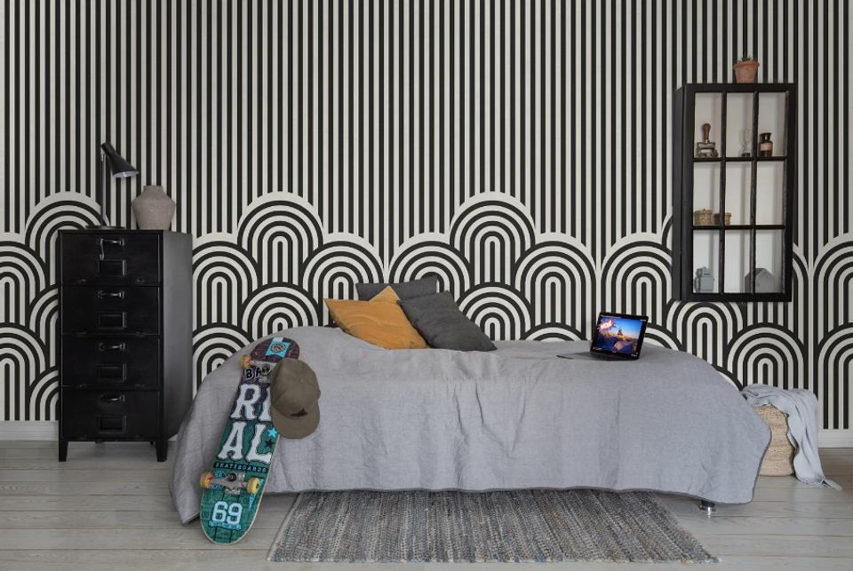 Modern teen bedroom with bold black and white geometric wallpaper, minimalist furniture, and cool contemporary aesthetic