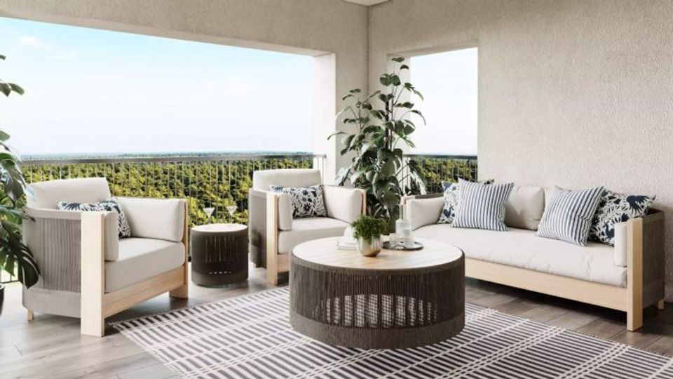 Modern patio with neutral upholstered seating, natural wood accents, and geometric patterned rug creating a sophisticated outdoor lounge aesthetic.