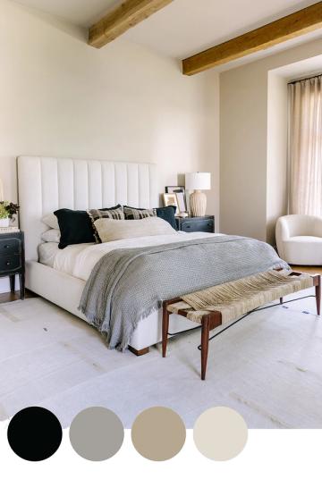 Contemporary bedroom pairing navy blue nightstand with soft beiges and creams for sophisticated, restful elegance.