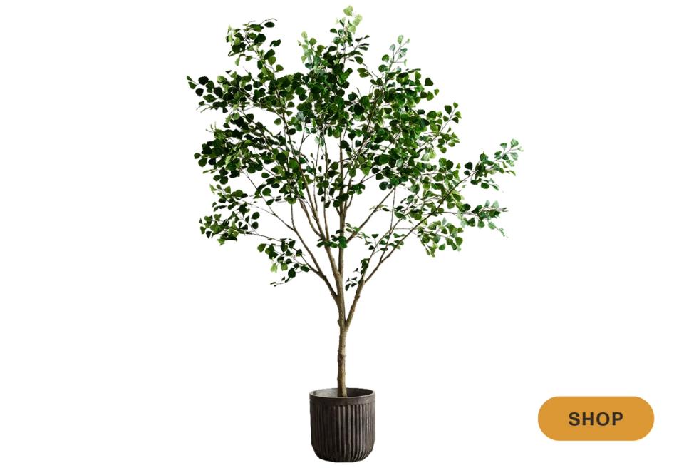 Faux tall tree in ribbed black planter for modern organic height and greenery accent
