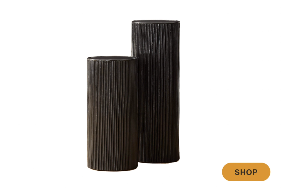 Sculptural black ribbed vases in varying heights for modern vertical display