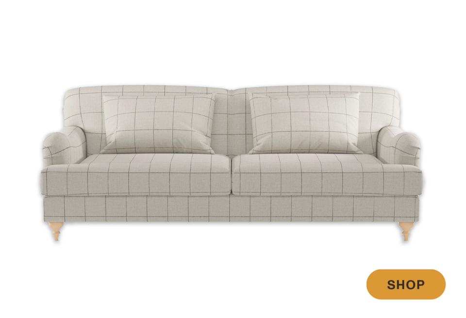 Scandinavian-inspired cream grid-patterned sofa with tapered wooden legs