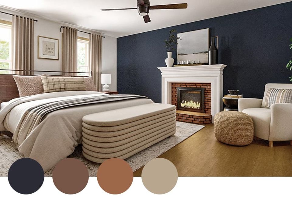 Contemporary bedroom blending navy accent wall with warm caramel, tan, and cream tones around a fireplace focal point