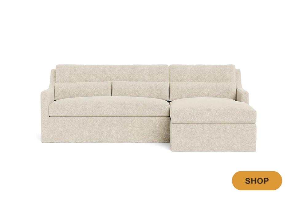 Neutral linen sectional with skirted base and relaxed, casual aesthetic