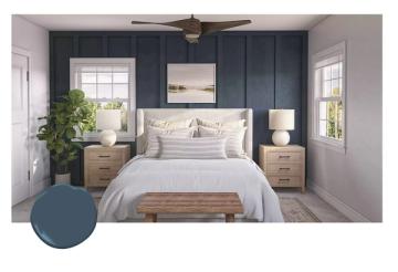 Serene coastal bedroom featuring navy shiplap walls, natural wood nightstands, and soft linens for calming, airy tranquility
