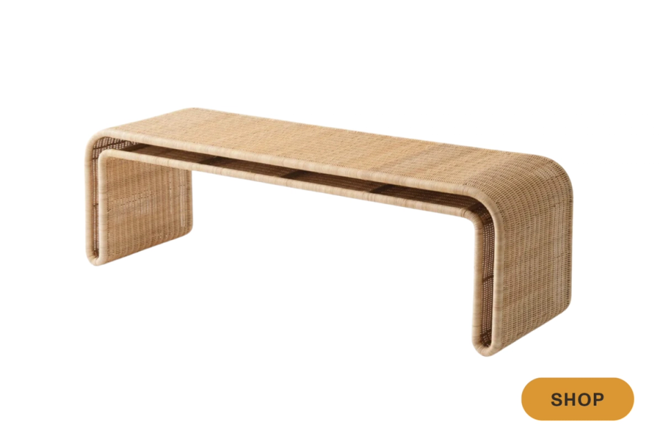 Natural rattan bench with curved edges and warm wood tones, organic coastal style
