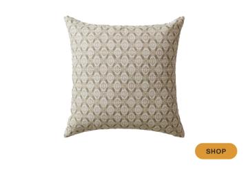 Beige throw pillow with subtle all-over geometric diamond trellis pattern
