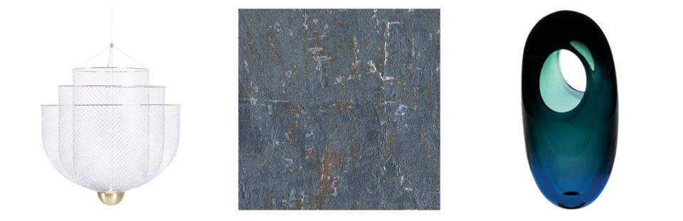 Modern design objects featuring sculptural lighting, textured blue-grey material, and organic curves in jewel tones