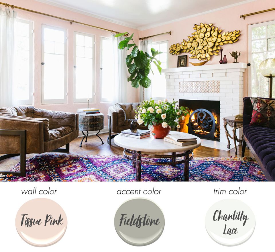 Eclectic living room with blush pink walls, jewel accents, and bohemian warmth