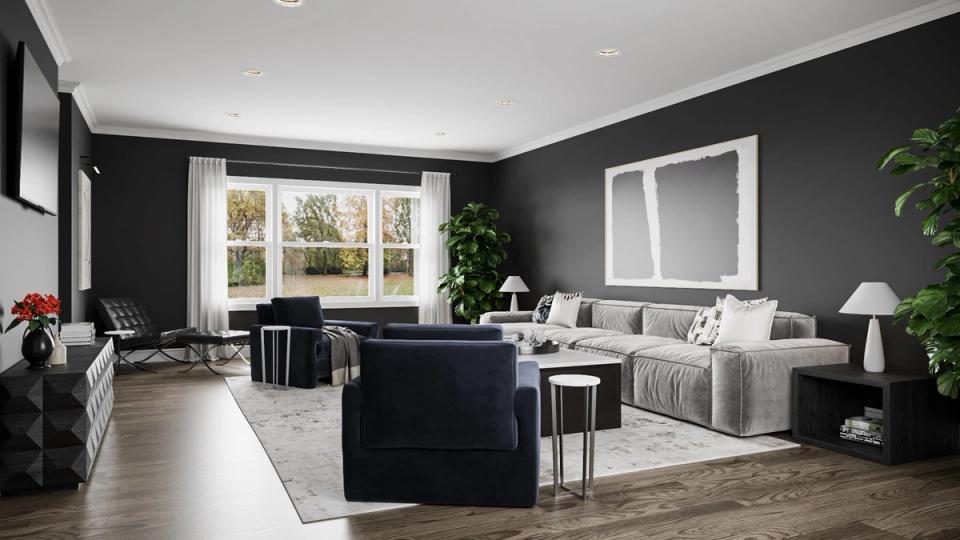 Modern living room with black accent wall, neutral furnishings, and natural light creating a sophisticated, balanced atmosphere