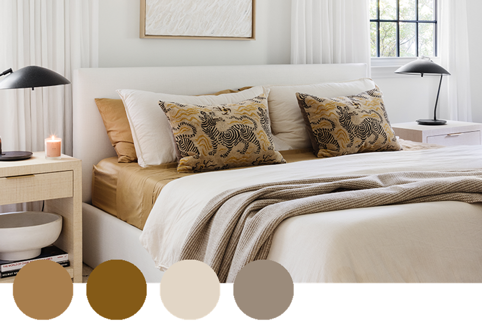 Tranquil bedroom with golden mustard pillows, warm beige, and soft modern aesthetic.
