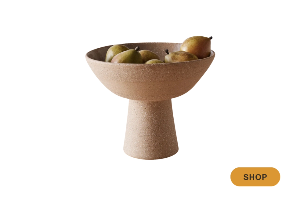Minimalist cork pedestal bowl with warm neutral tones and organic sculptural form