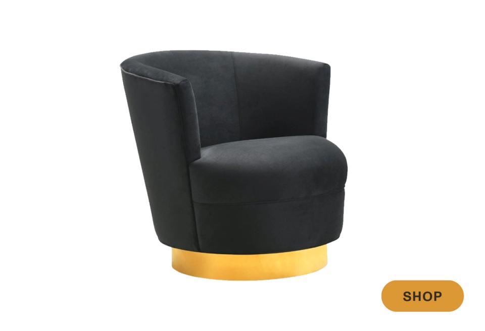 Contemporary black swivel chair with curved form and brass base accent