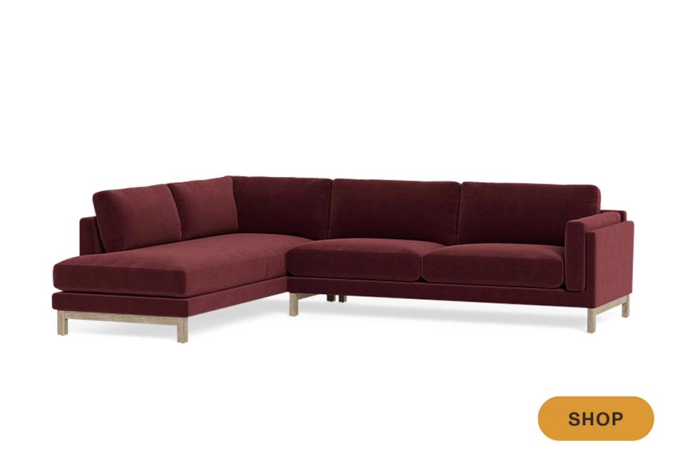 Modern burgundy velvet sectional with metal legs and contemporary styling