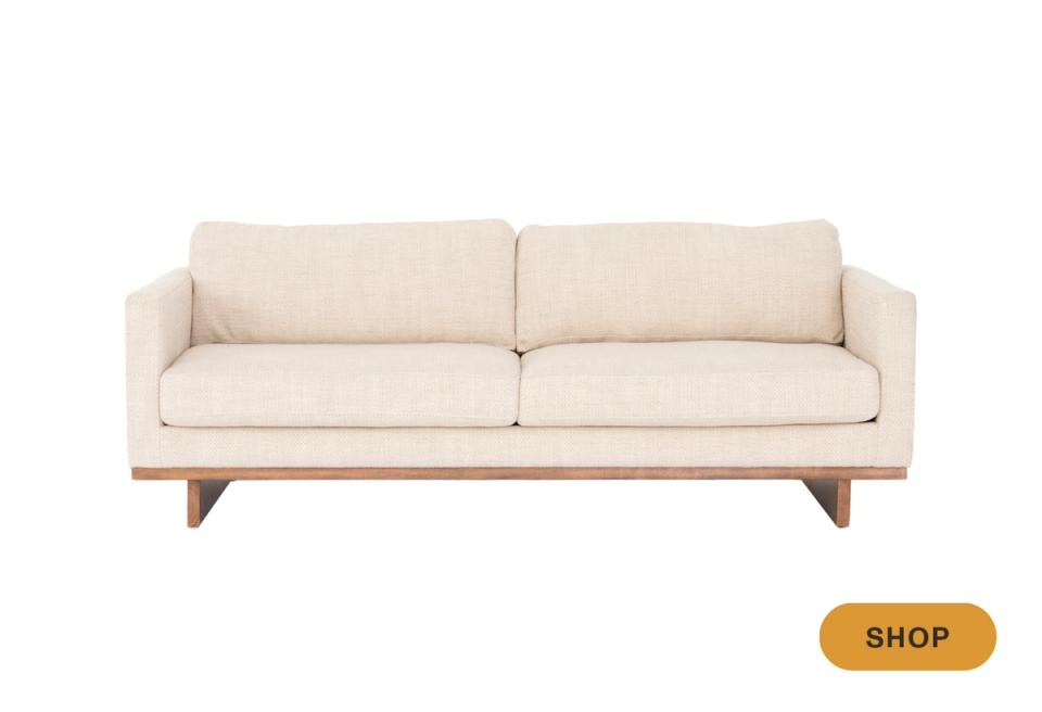 Natural linen mid-century modern sofa with exposed wood base and angled legs