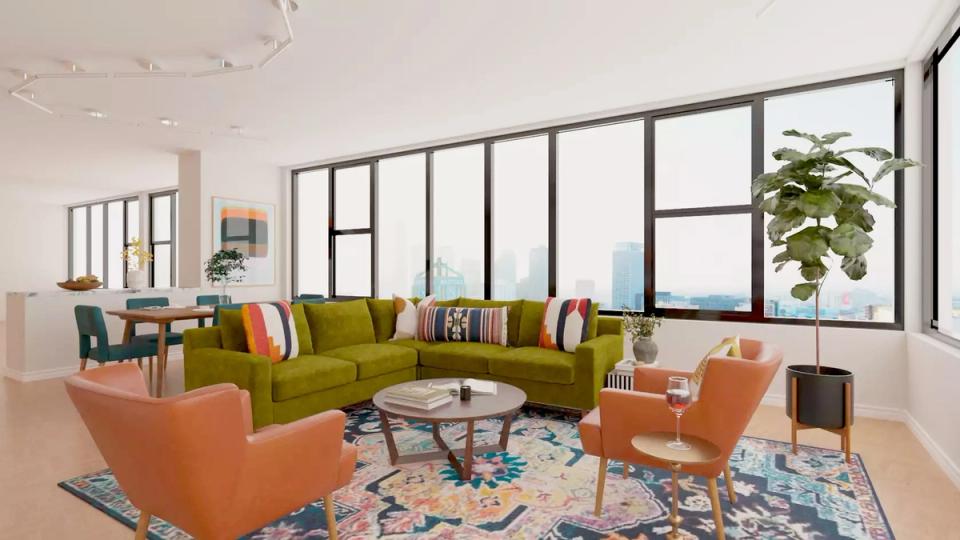 Bold mid-century modern space with olive sofa, orange chairs, and geometric patterned rug