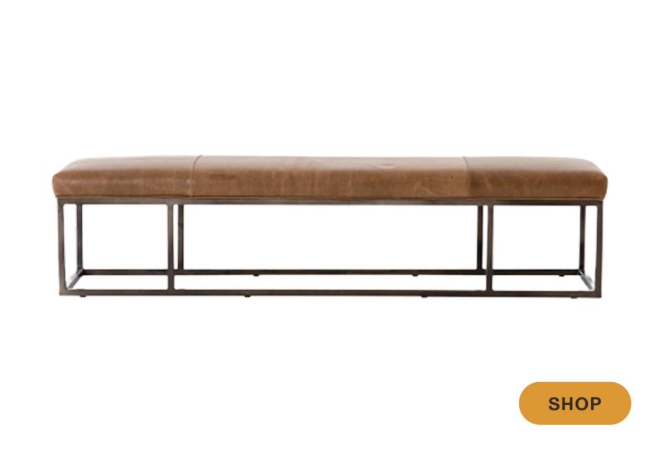Industrial leather bench with cognac brown upholstered seat and sleek metal frame in gunmetal finish