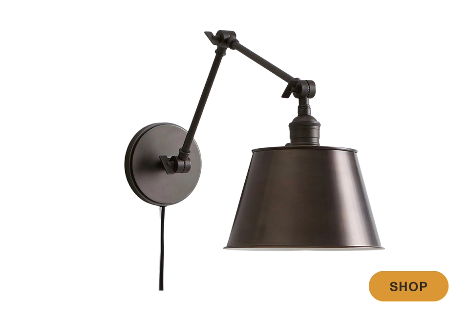 Industrial black swing-arm sconce with tapered shade and articulating arm