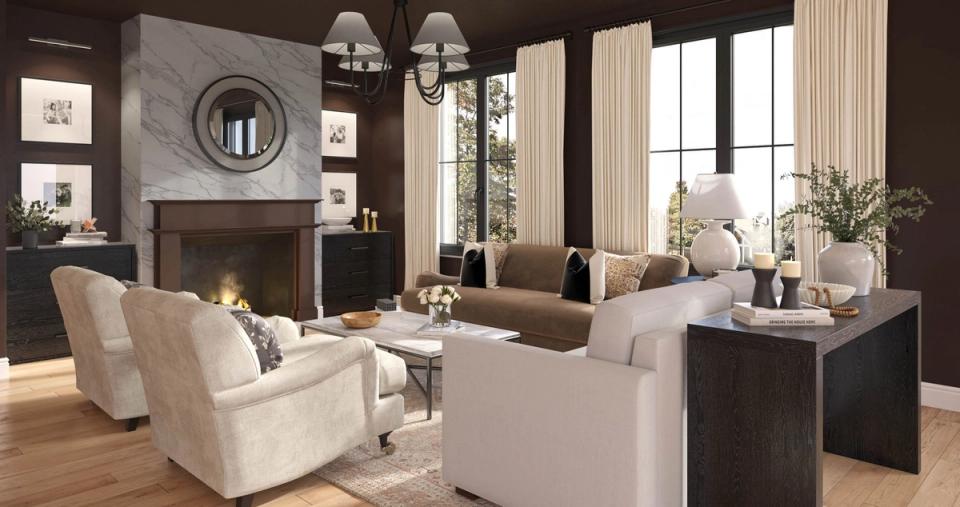 Sophisticated living room with deep brown walls, cream seating, and marble fireplace creating an elegant moody aesthetic