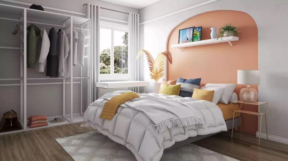 Soft peach arch headboard with curved nook shelving and warm-toned bedding in airy bedroom