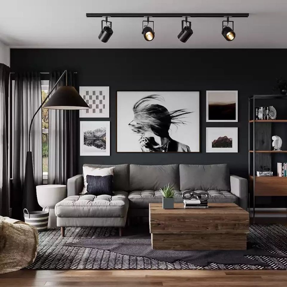 Modern living room with dramatic black accent wall, gallery art display, gray sectional, and contemporary track lighting creating urban edge