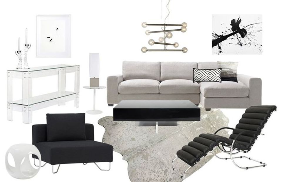 Minimalist living room with gray sofa, black accent chair, abstract black artwork, and understated black and white styling