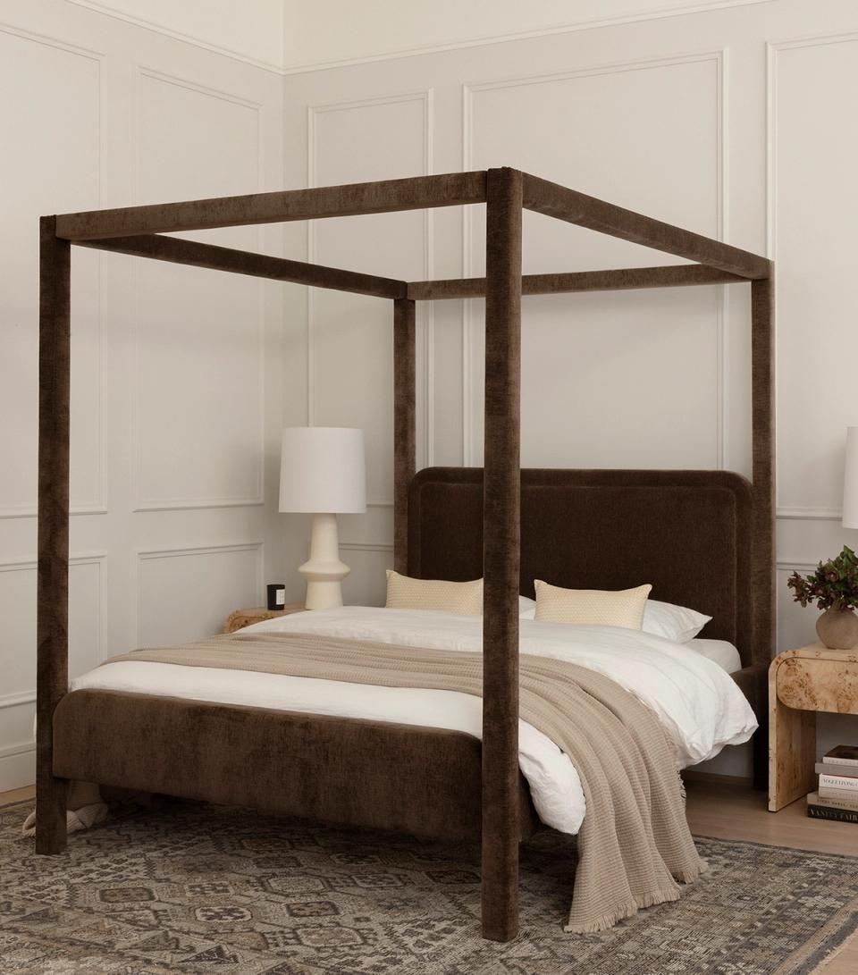 Elegant dark wood four-poster bed with wainscoting, soft linens, and transitional style
