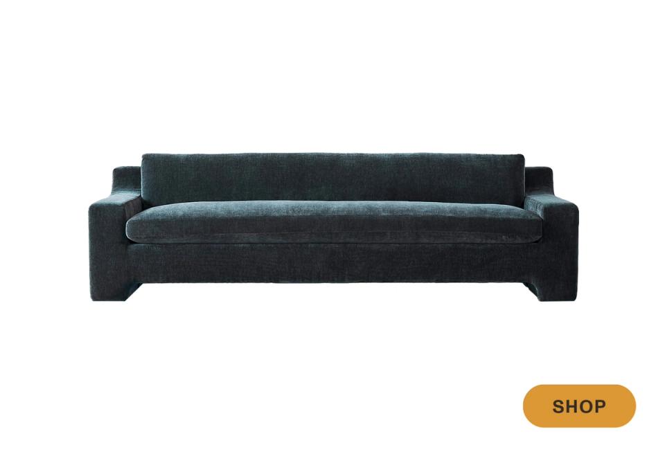 Contemporary charcoal sofa with bold architectural frame and low-profile silhouette