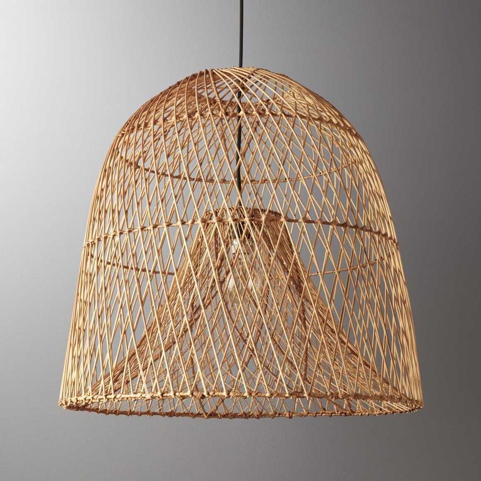 Woven rattan pendant light with warm natural texture and organic bohemian aesthetic