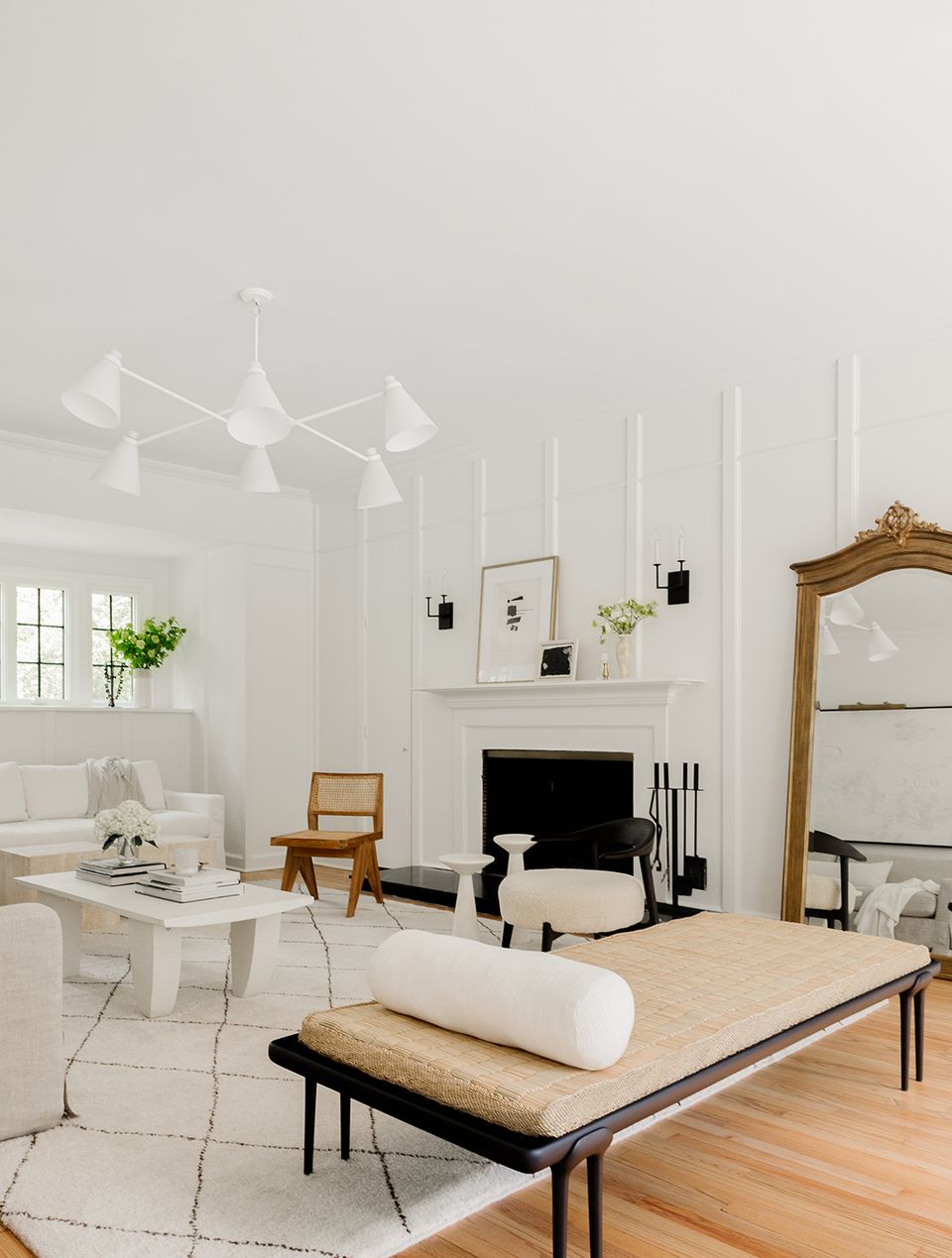 Light-filled Victorian space with white palette, natural wood, and mid-century modern touches