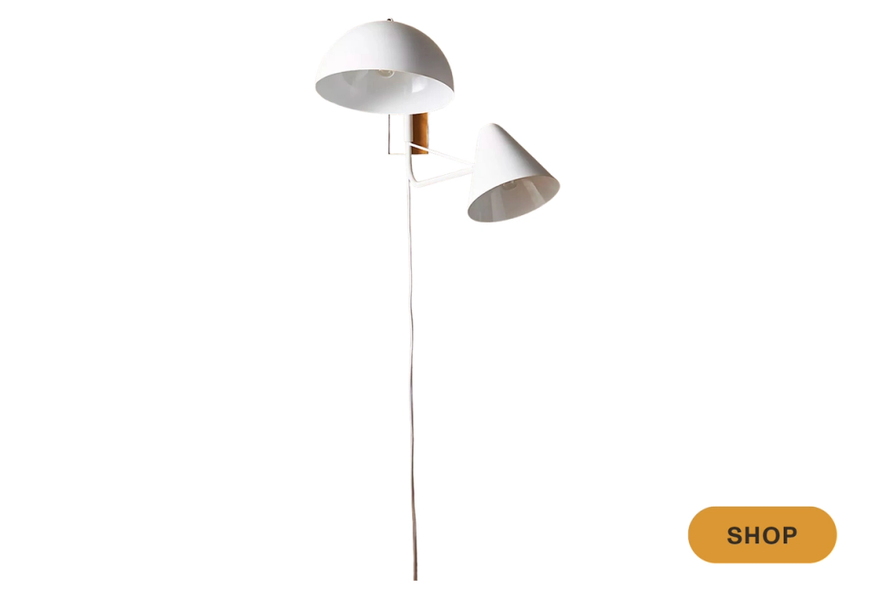 Minimalist dual pendant sconce in brushed metal with clean, contemporary design