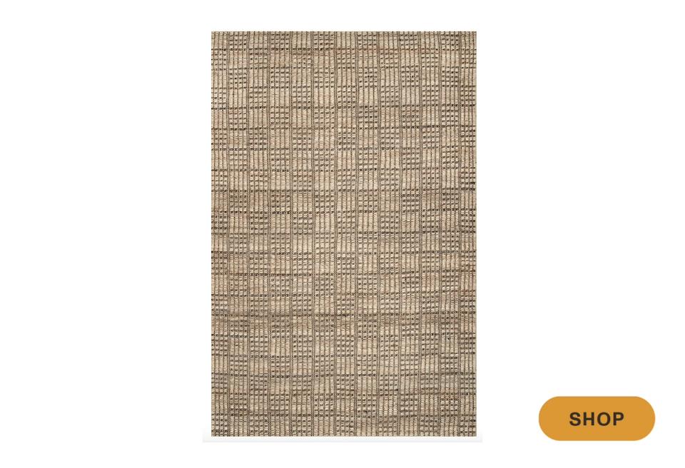 Woven area rug in neutral checkerboard weave with warm beige tones