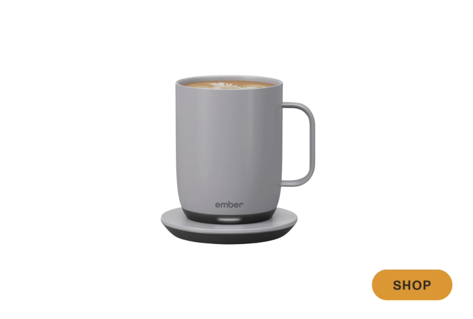 Sleek gray ceramic mug with warm minimalist aesthetic and heated base