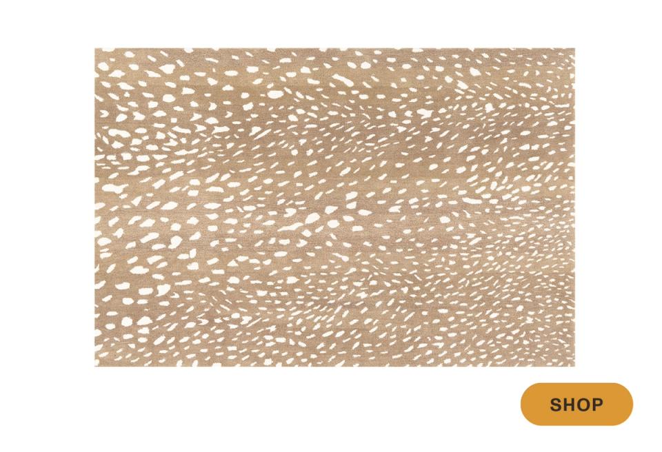 Natural jute area rug with organic dot texture in warm beige and cream tones
