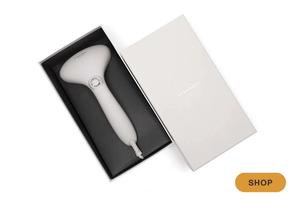 Modern tech-forward handheld cleaning device in sleek white and gray packaging