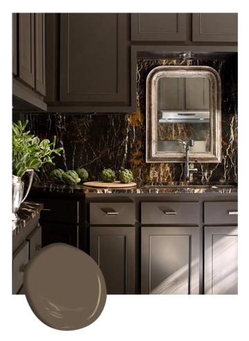 Luxe charcoal kitchen with dark cabinetry, black marble backsplash, and brushed gold fixtures creating elegant, dramatic modern design.