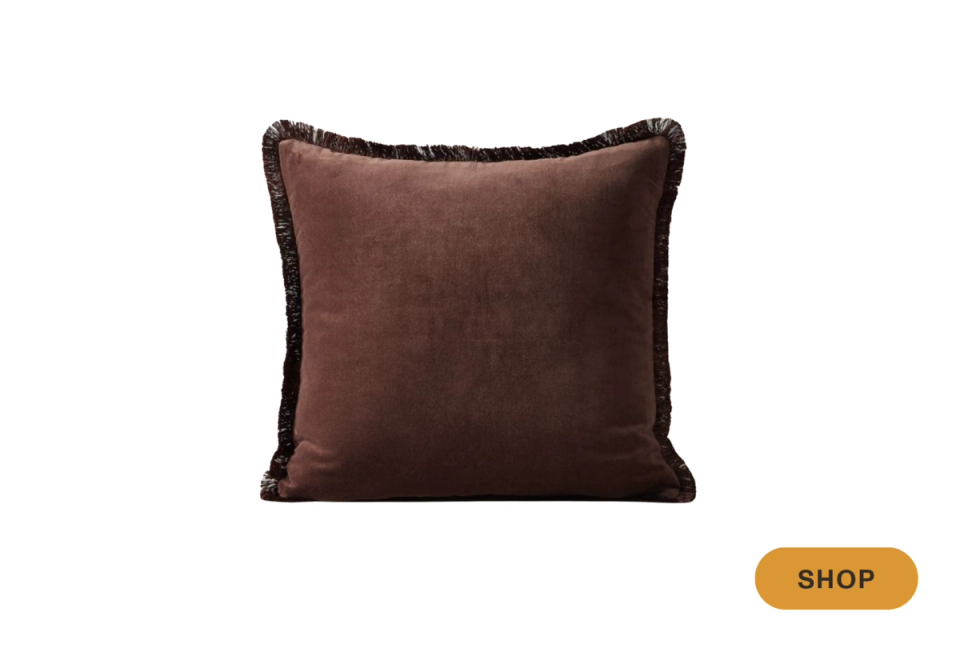 Modern chocolate brown velvet throw pillow with textured fringe trim