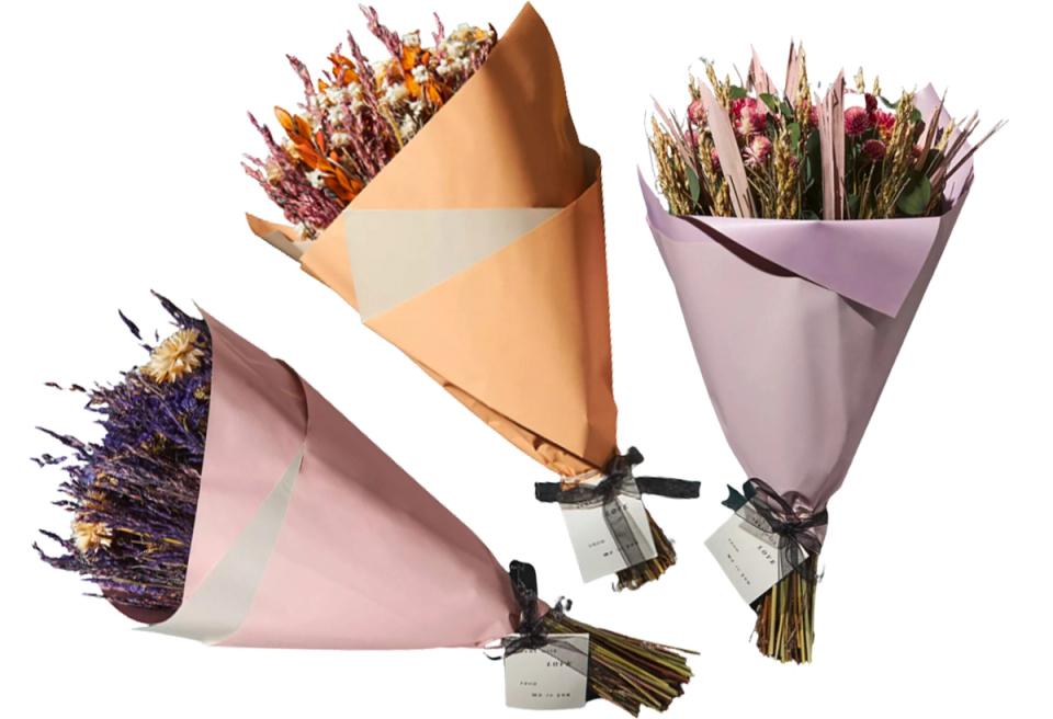 Contemporary trio of wrapped dried bouquets in blush, lavender, and peach tones