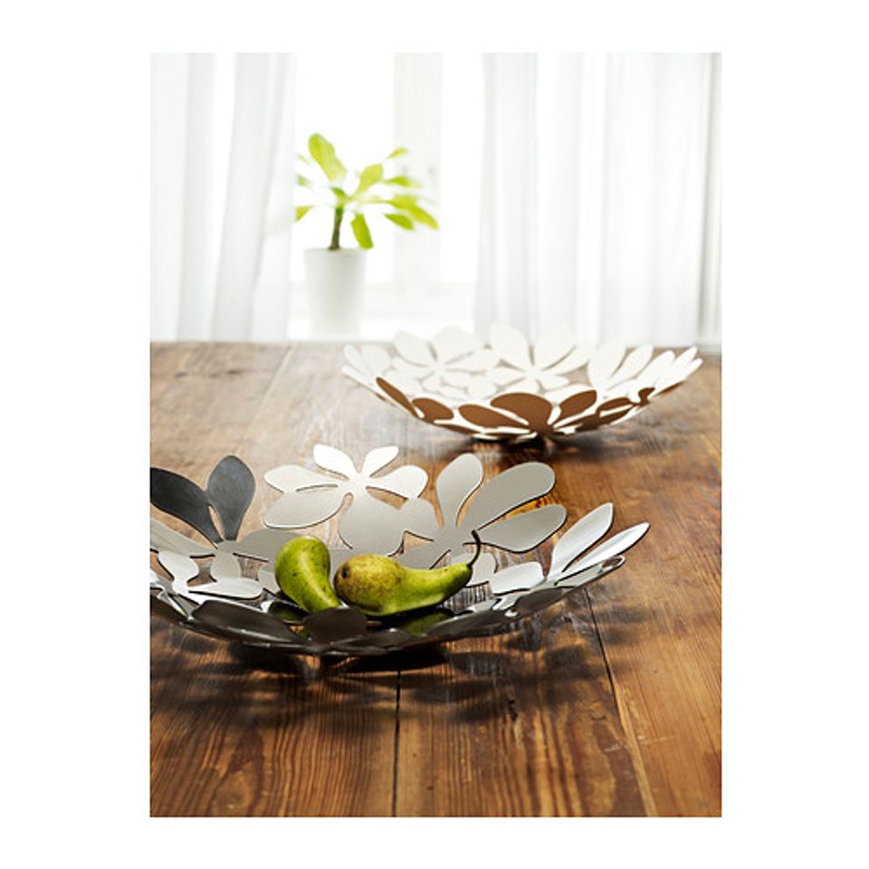 Scandinavian-inspired tabletop with metallic decorative bowls and fresh lime green accents