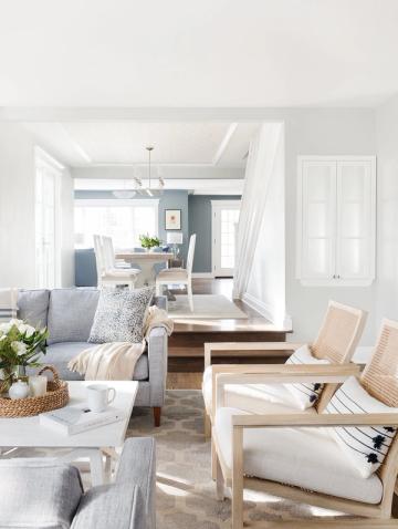 Scandinavian-inspired neutral space with light wood furnishings, soft cream tones, and clean architectural lines