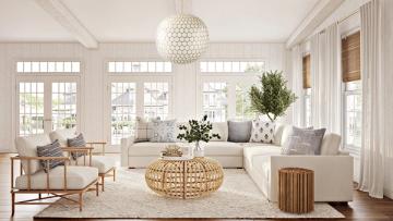 Coastal-inspired bright living room with natural wood furniture and abundant natural light