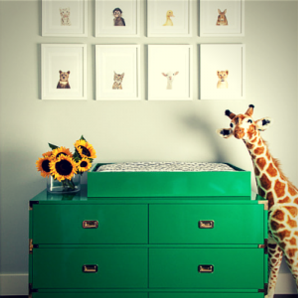 Cheerful green campaign dresser with whimsical animal art and botanical florals in soft palette