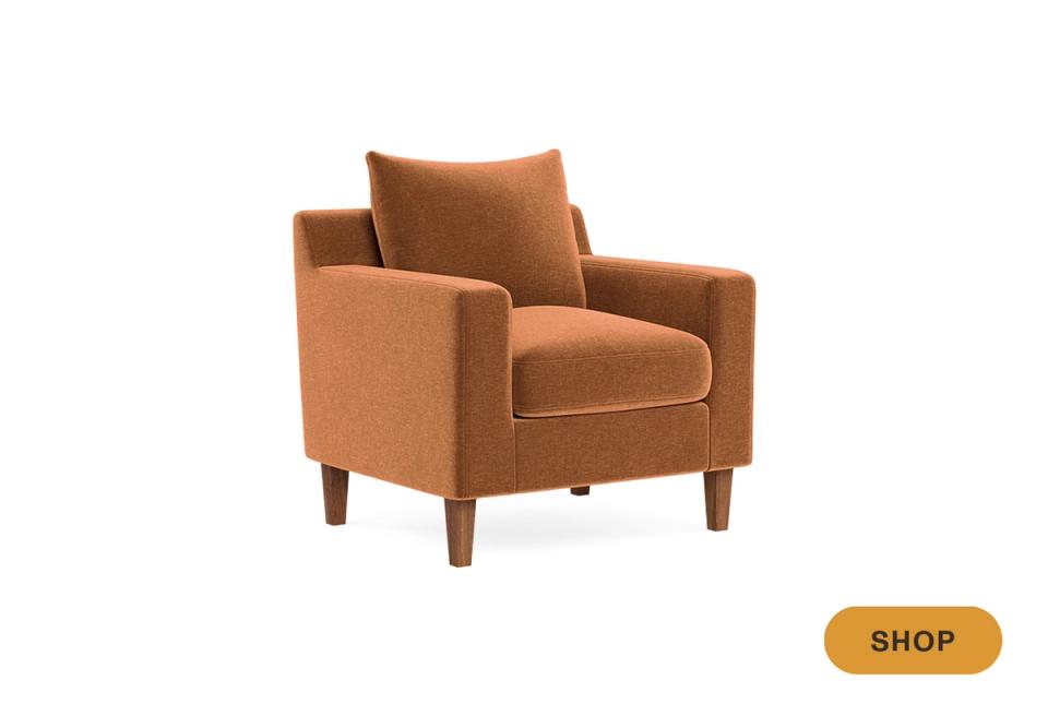 Rust-toned mid-century modern accent chair with compact proportions