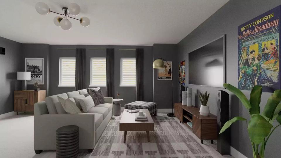 Atmospheric charcoal living room with cream sofa, vintage wood furnishings, and botanical accents